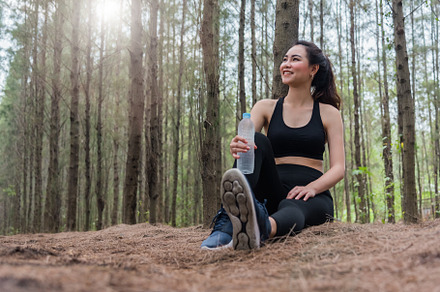 Beauty Asian sport woman resting and holding drinking water bott, a Sports & Recreation Photo by Ministocker
