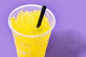 Yellow Slush Drink in Plastic Cup with Black Straw, a Food & Drink Photo by etorres69