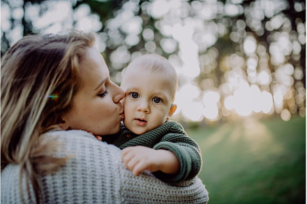 Mother holding her little baby son, a Nature Photo by HalfPoint