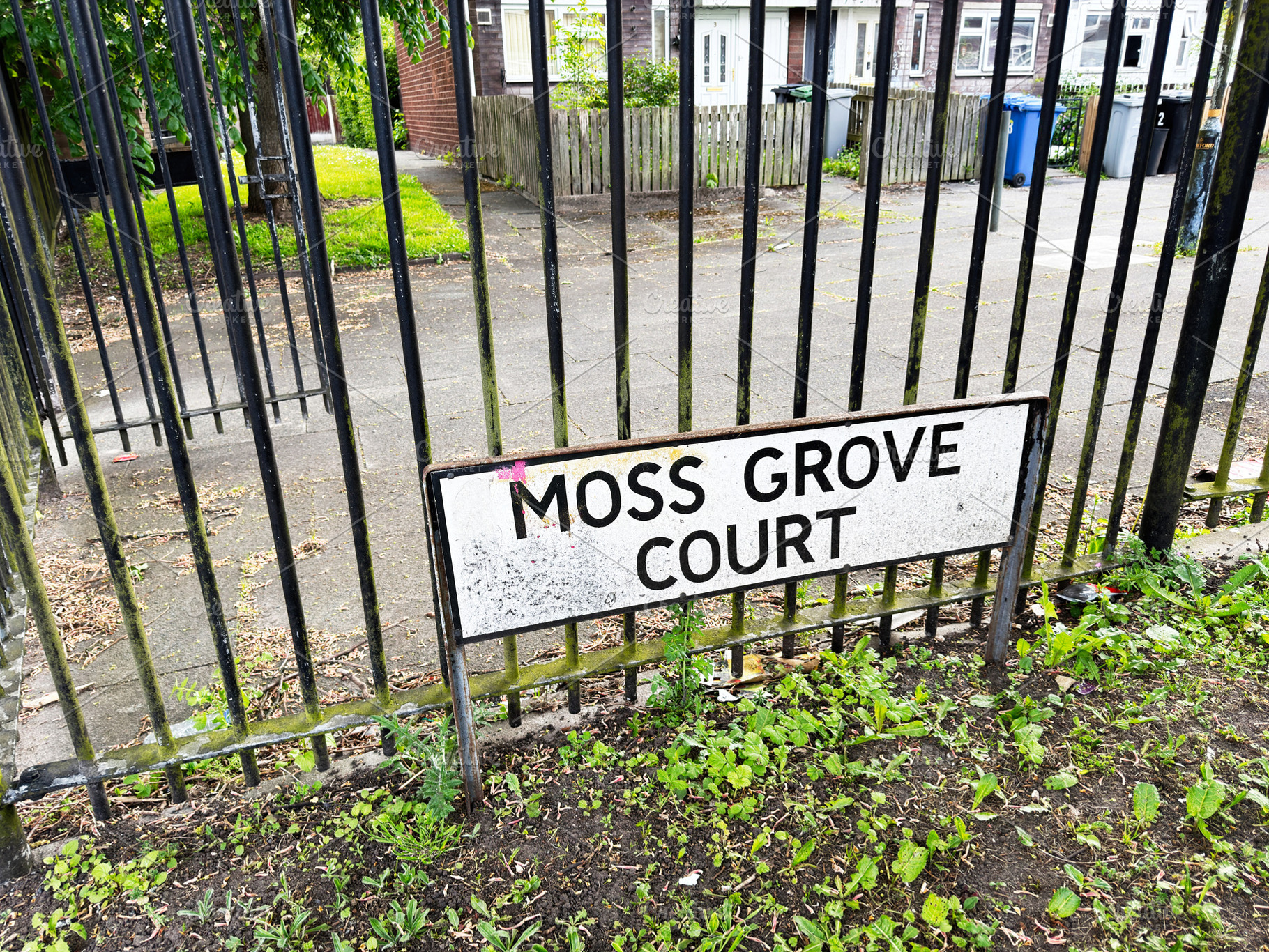 Moss Grove Court street sign on iron railings in a residential M, a Photo by AS photostudio