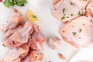 Different chicken meat, with spices, condiments, sauces, marinad, a Food & Drink Photo by Rimma