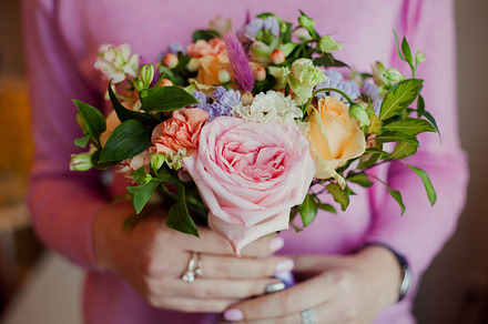 Girl in pink sweater holding a beautiful lush bouquet with roses, gift, an Arts & Entertainment Photo by LiaKoltyrina