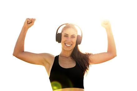 Woman with headphones raising arms, a Sports & Recreation Photo by Perpis