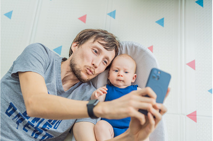 Loving father interacts with his 3