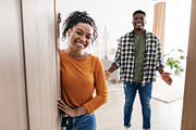 African Spouses Meeting You Standing In Opened Doors At Home, a Photo by Prostock-Studio (Thumbnail 1 of 2)