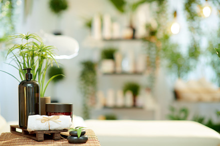 towel, hot stone massage and cosmetics in modern beauty studio, a Health & Medical Photo by Alliance Images