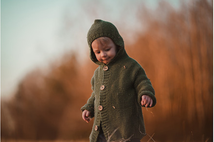 Little curious boy in knitted, a Person Photo by HalfPoint