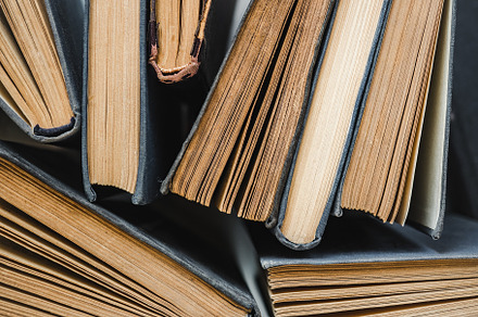 Stack of vintage books lying on the table, a School & Education Photo by Svetlana Barchan