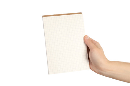 Female hand holds notebook, isolated on white background, a Beauty & Fashion Photo by AtlasStudio PRO