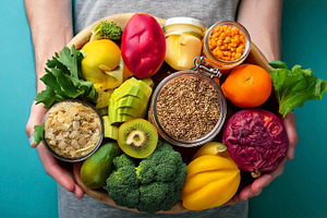 Fruits and vegetalbles elements over turquoise color background, a Food & Drink Photo by DanFLCreativo