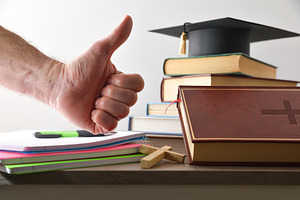 Religious educational material and hand with OK gesture, a School & Education Photo by Davizro's Market