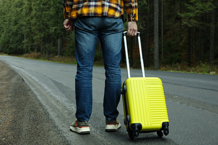 Adventure and tourism concept, young man traveling by auto stop, a Nature Photo by AtlasStudio PRO