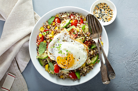 Fresh quinoa tabbouleh salad with fried egg, a Food & Drink Photo by farwasser