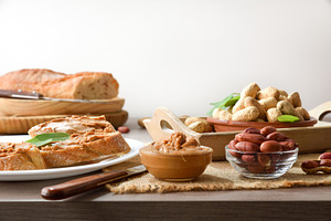 Wooden table with freshly prepared peanut butter snack, a Food & Drink Photo by Davizro's Market