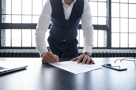 Business man signing contract making, a Business Photo by OPOLJA