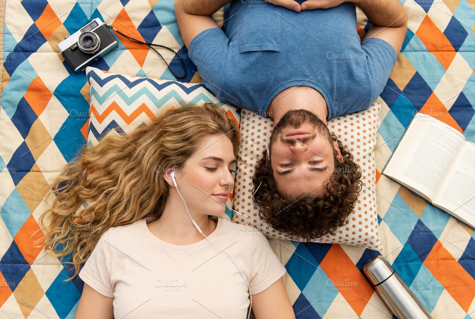 Couple Relaxing on Picnic Blanket, a Person Photo by Virgo Studio