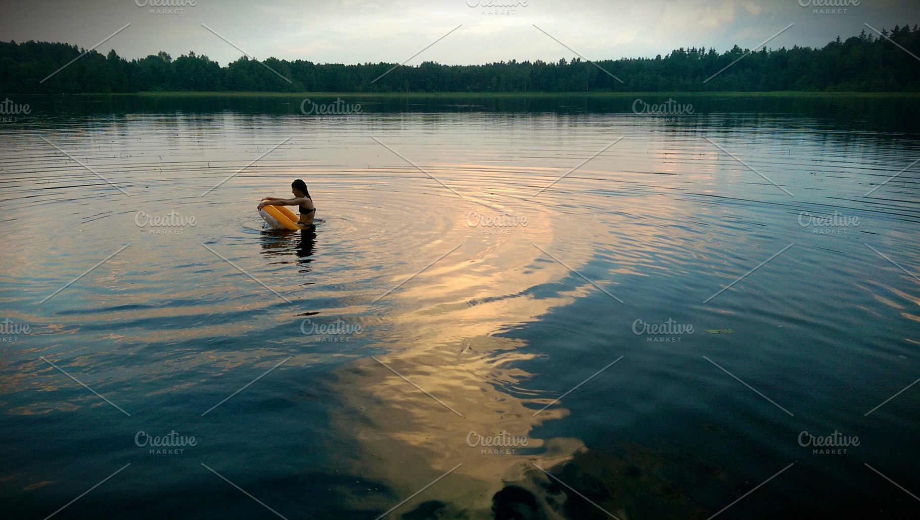 Lonely girl swimming on the lake, a Nature Photo by BOOCYS