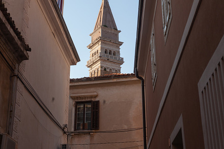Free standing bell tower of Cathedral of St. Georges between houses, Piran, an Architecture Photo by Bepslabor