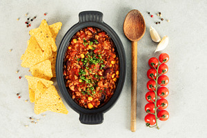 Mexican Chili Con Carne with Corn Chips, Peppers, and Tomatoes, a Food & Drink Photo by Natalia Klenova's Shop