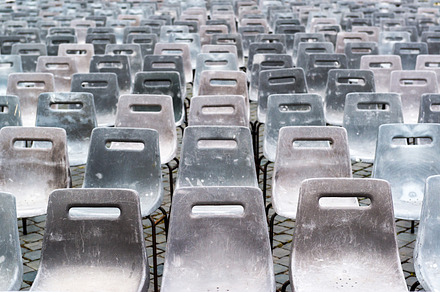 Empty old gray plastic chairs, an Abstract Photo by Lopatin Photo