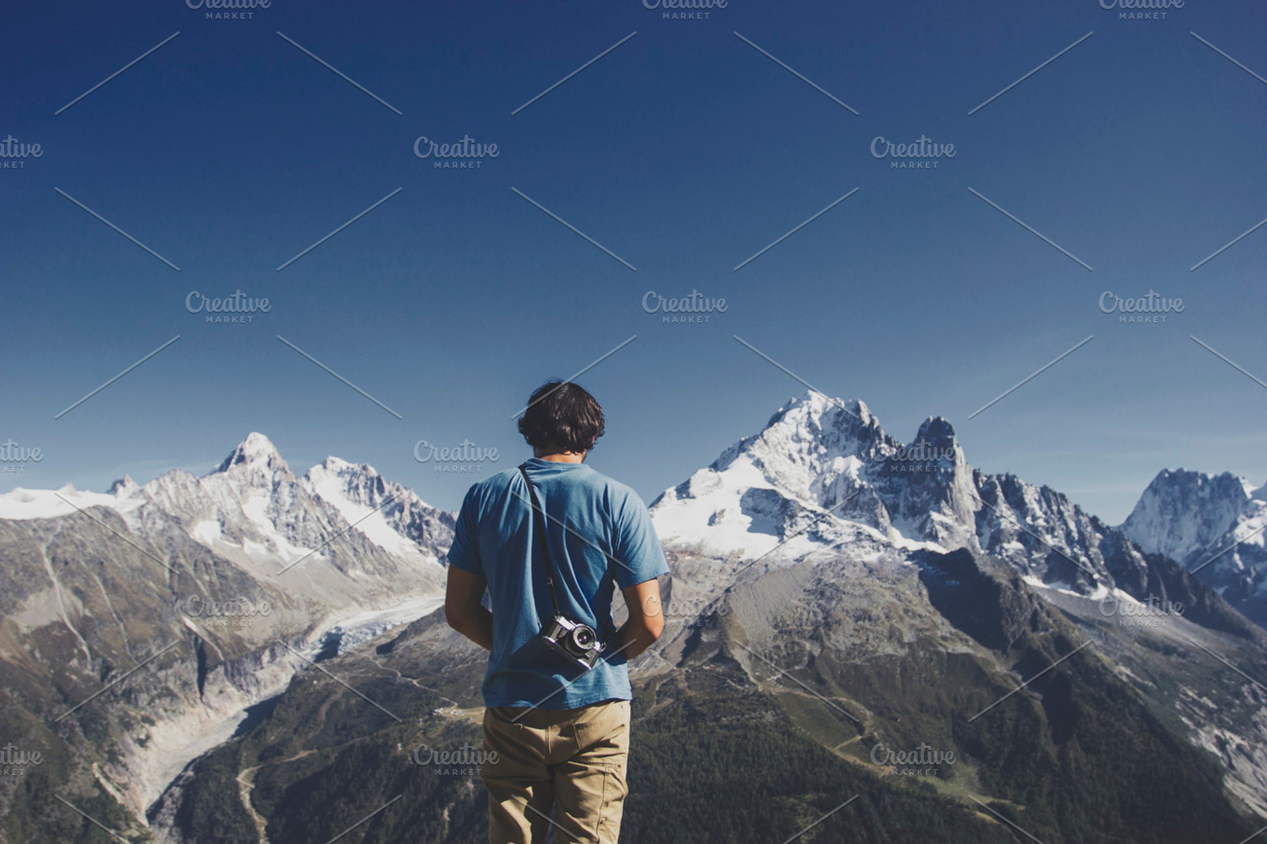 Hiker with camera enjoying the view featuring mountain, view, and hike, a Holiday Photo by Mukuko Studio