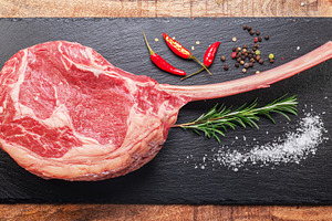 Raw rib steak with bone, a Food & Drink Photo by Volff