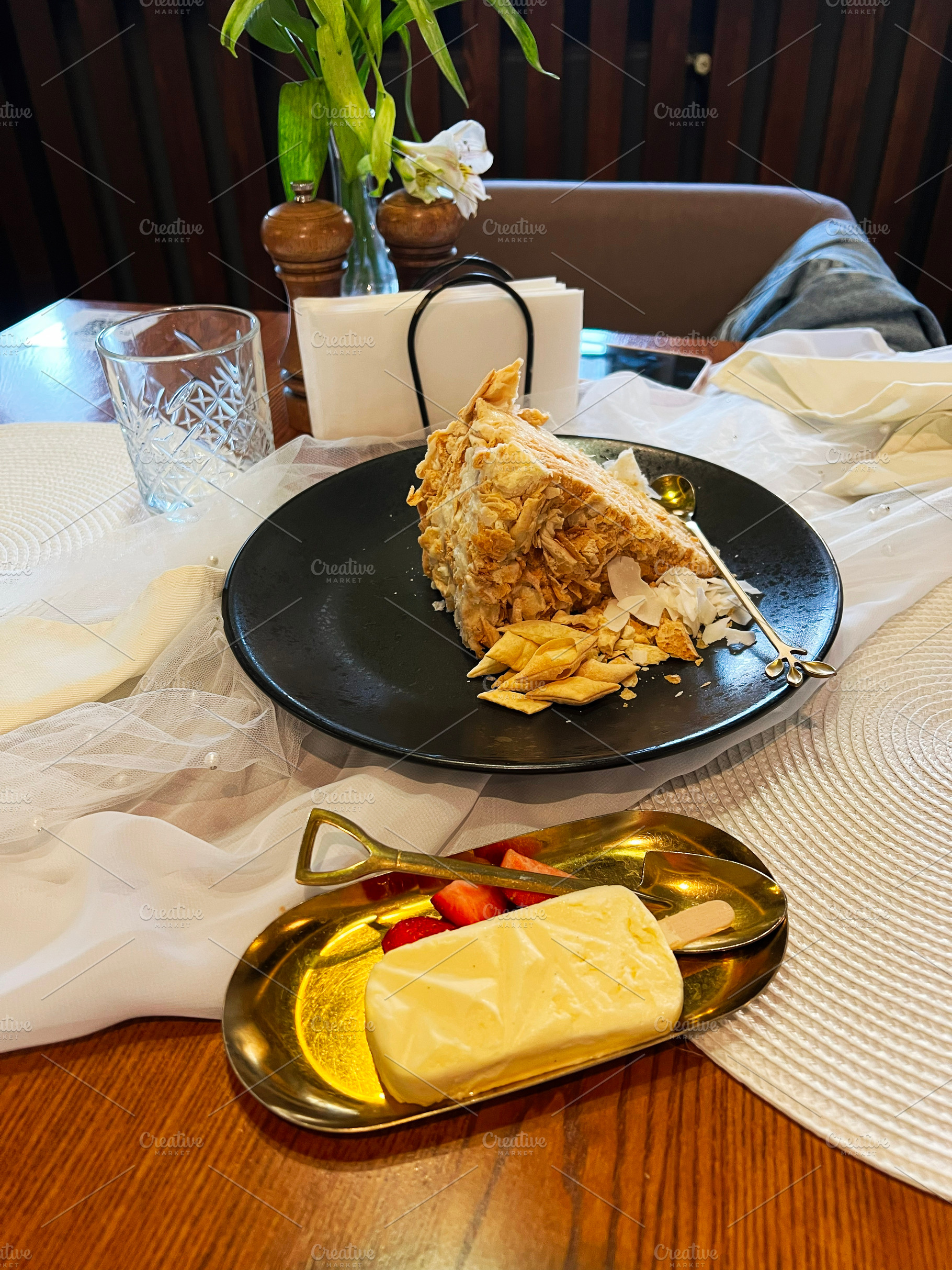 Elegant dessert setting with pastry, butter, and strawberries in vintage presen, a Photo by AS photostudio