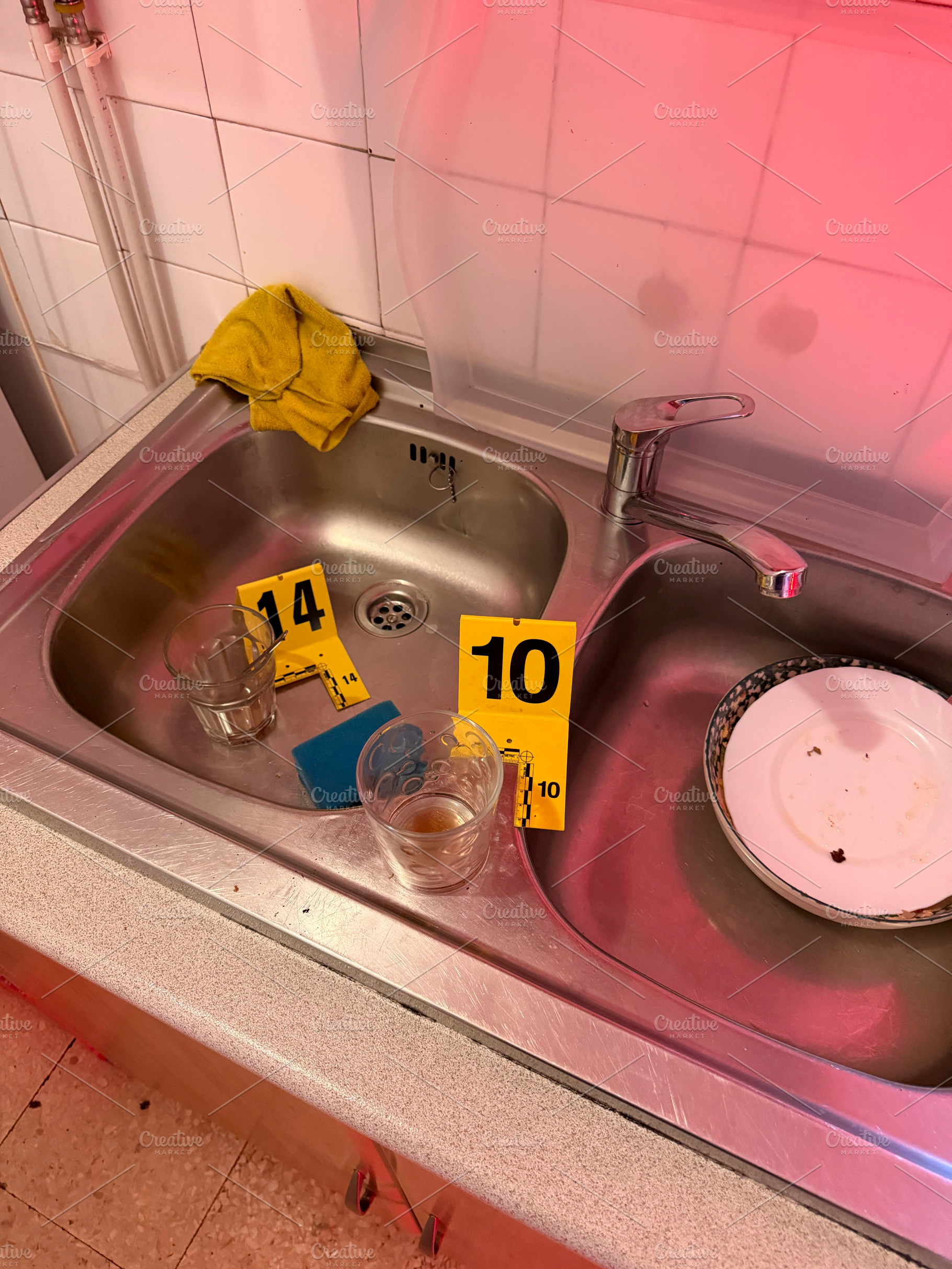 Investigating crime scene evidence in kitchen sink, an Industrial Photo by karrastock