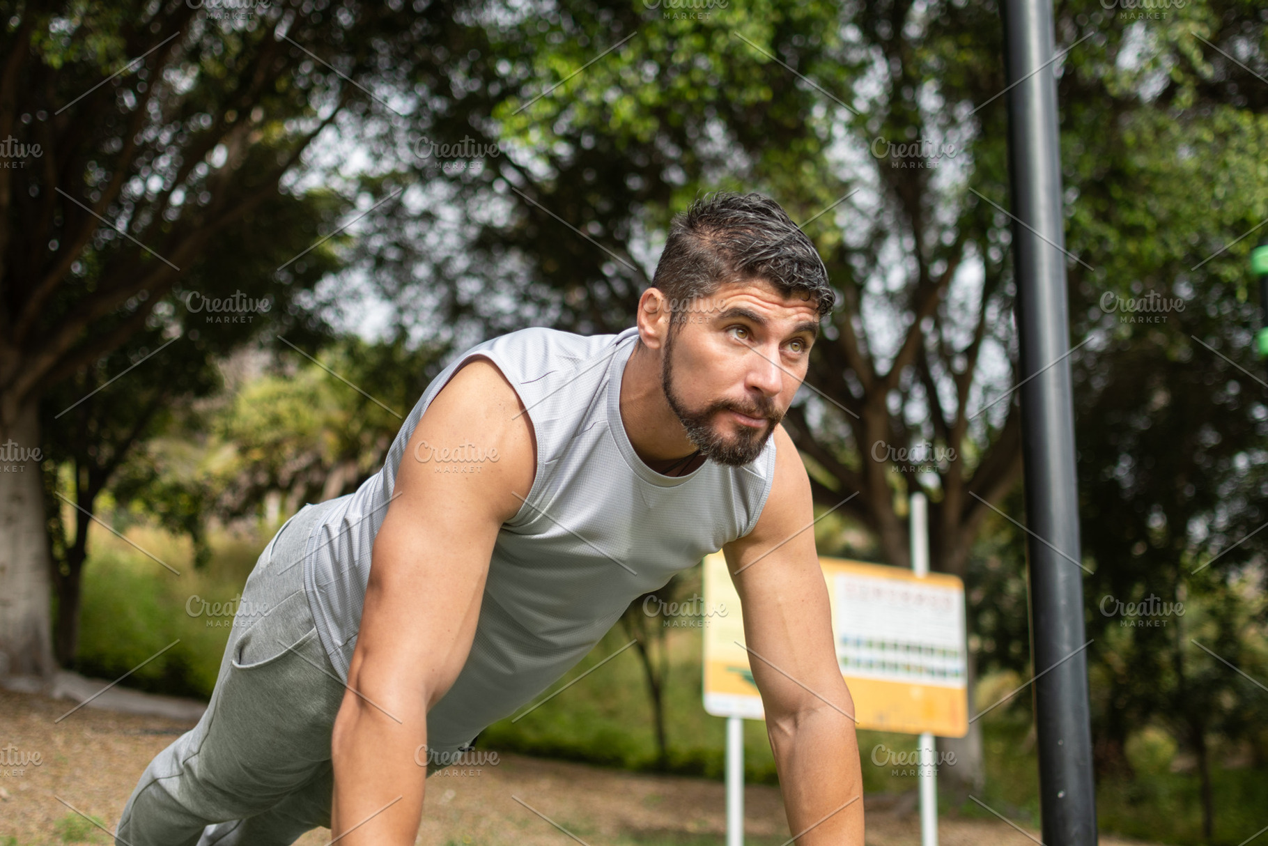 Young man doing push-ups workout in park outdoors, a Sports & Recreation Photo by etorres69