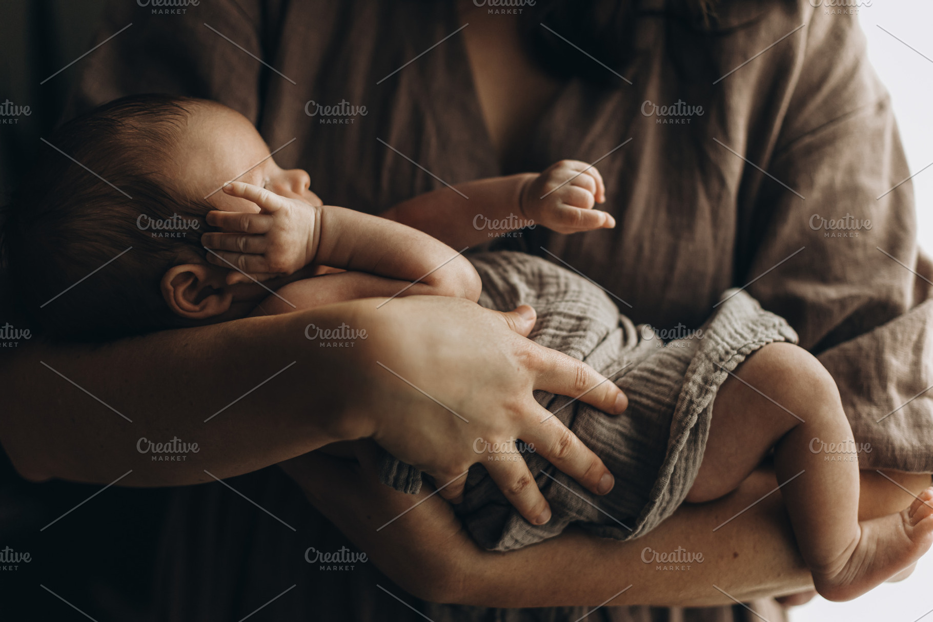 Happy Mothers day! Mother hugging cute little newborn baby close, a Person Photo by Sonjachni
