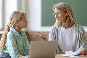 Teacher explaining lesson to student, a School & Education Photo by 7DesignLab
