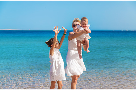 Mother with her daughters at sea, a Person Photo by yanadjana