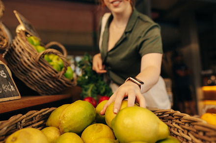 Happy customer buying fruits and vegetables in a grocery store, a Person Photo by Jacob Lund