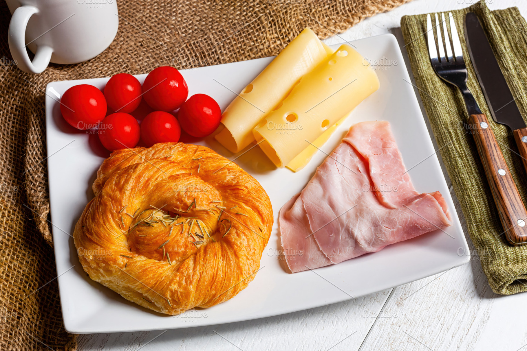 Savory breakfast with ham, cheese, tomatoes and rosemary brioche, a Food & Drink Photo by Antonio Gravante Market