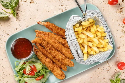 Breaded shrimps served with french fries
