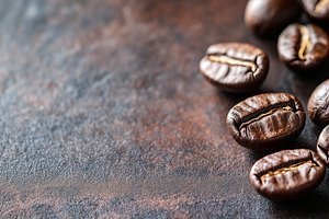 Coffee beans isolated on dark stone, a Food & Drink Photo by MistyDay