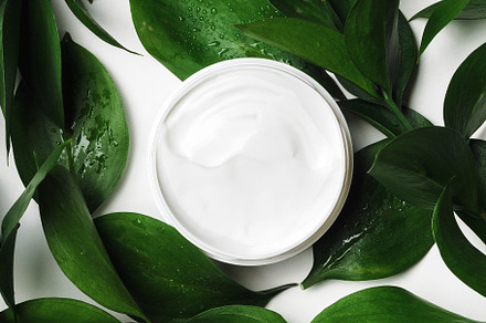 White cream in open jar