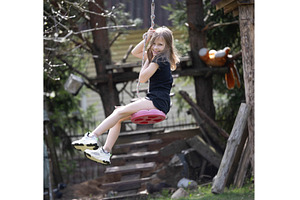 Little happy girl on a bungee, a Person Photo by Nenahliadava Design