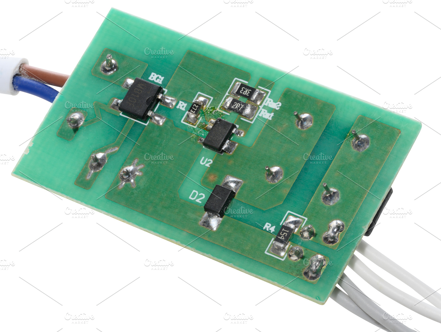 Green electronic board with various components and several wires, a Technology Photo by ndanko