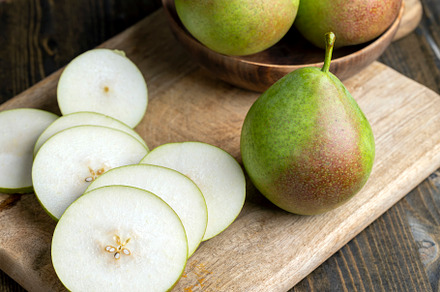Sliced ripe green pear, close up, a Photo by MyPhotos