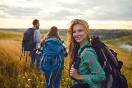 Group of friends trekking with stock photo containing trekking and hiking, a Person Photo by StudioRomantic