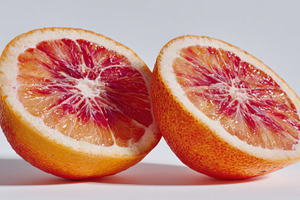 Vibrant blood oranges sliced open, a Photo by Beautiful things