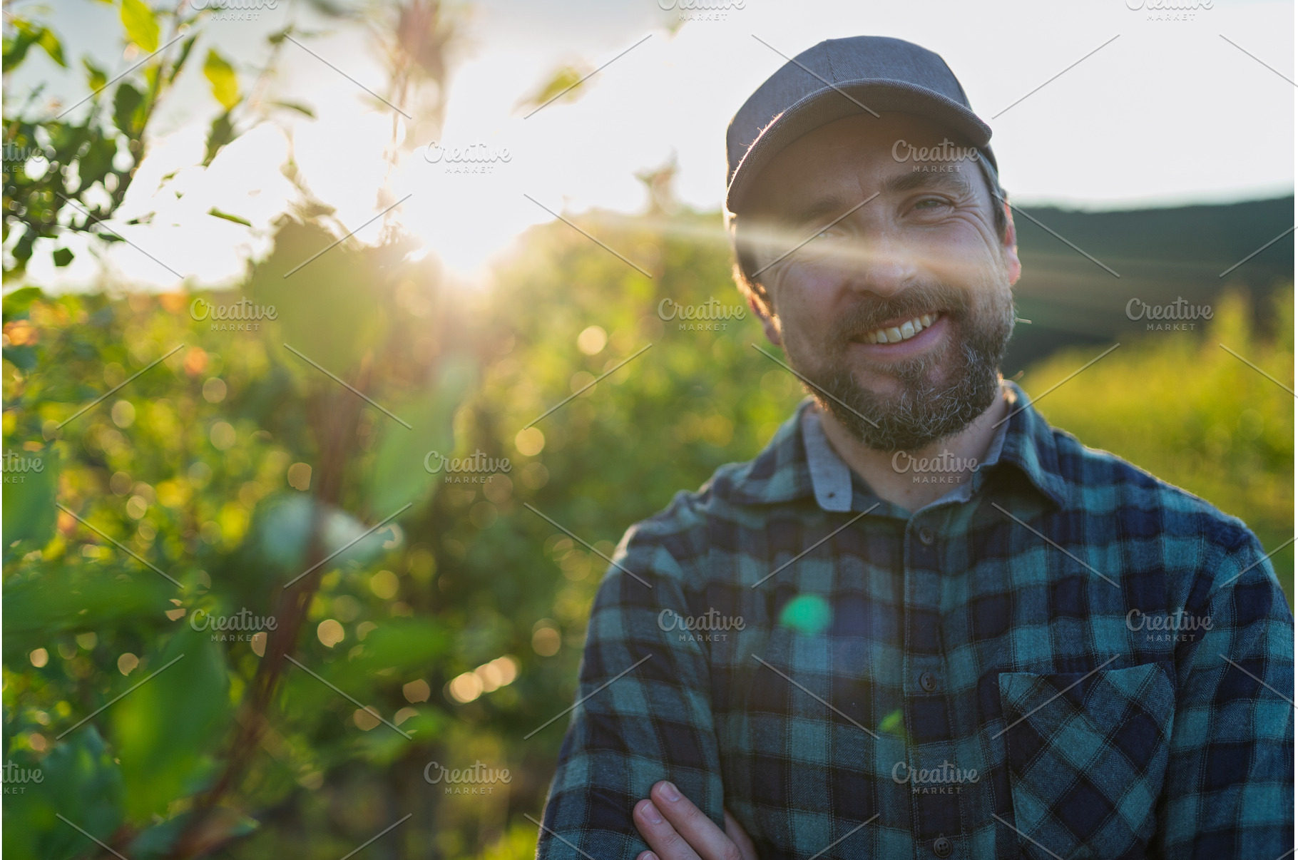 A mature farmer standing in the, a Person Photo by HalfPoint