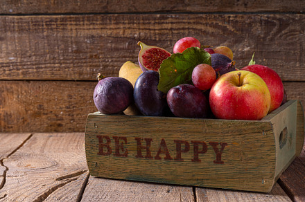 Autumn fruit assortment on wooden background, a Food & Drink Photo by Rimma