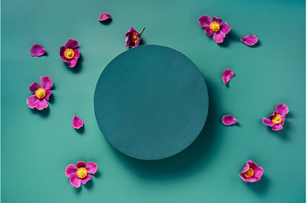 A round dark teal on blue green