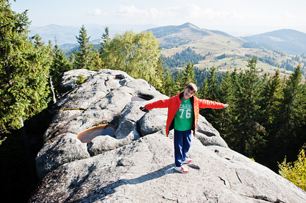 Boy on top of mountain. Children hiking on beautiful day in moun, a Nature Photo by AS photostudio