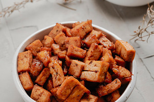 diced marinated tofu in a pair of white bowls, a Photo by Nito