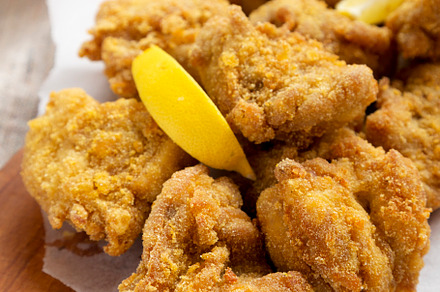 Homemade traditional japanese fried chicken Karaage on a rustic, a Food & Drink Photo by LiudmylaChuhunova