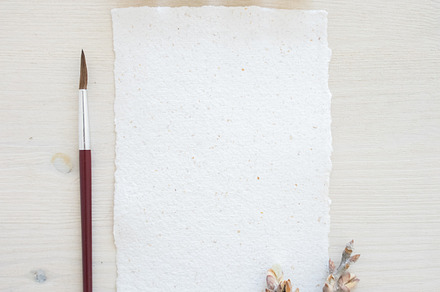 Paper and watercolor pack containing pastel shades, table, and paper