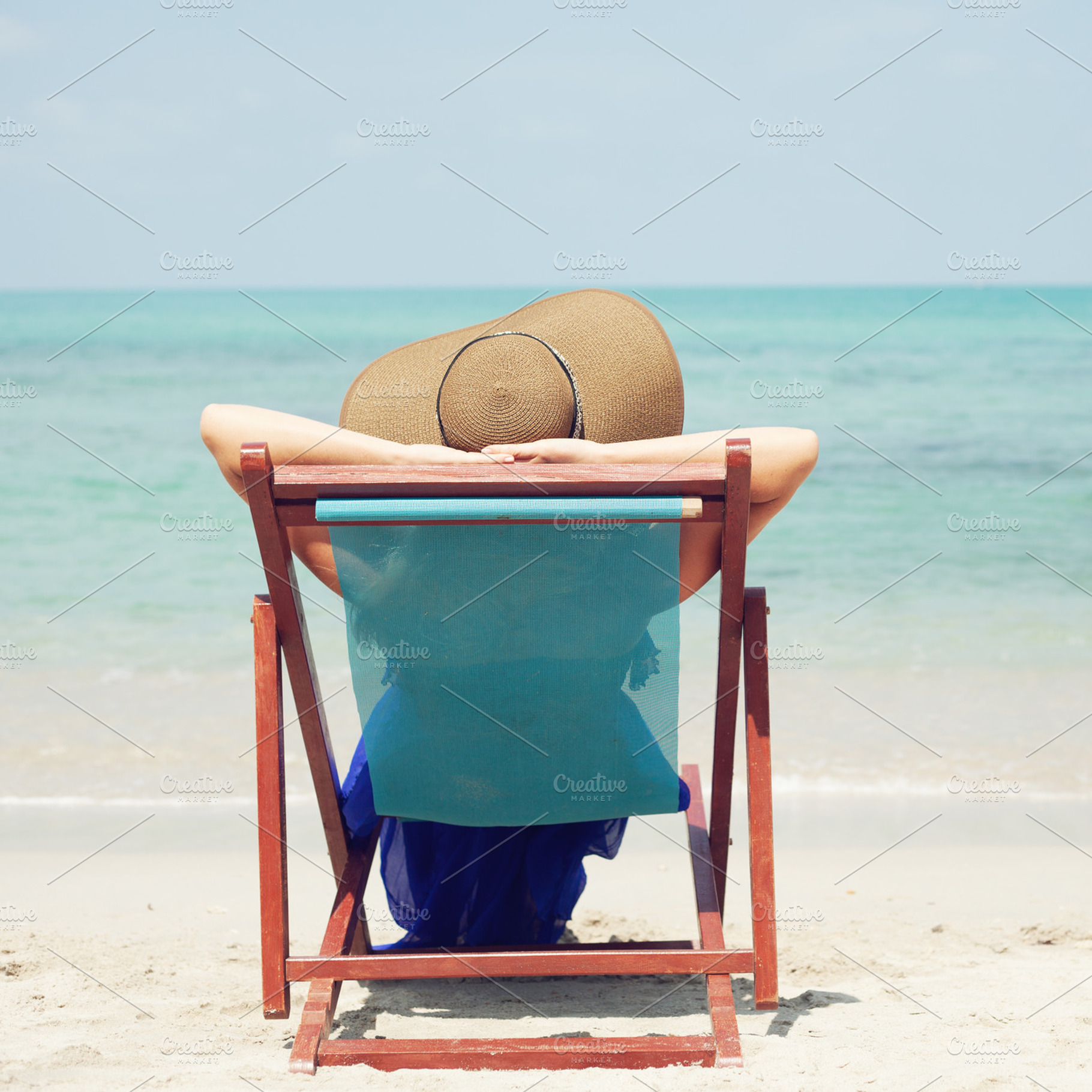 Woman relaxing on a tropical beach featuring woman, beach, and water, a Person Photo by Aliaksei Kaponia